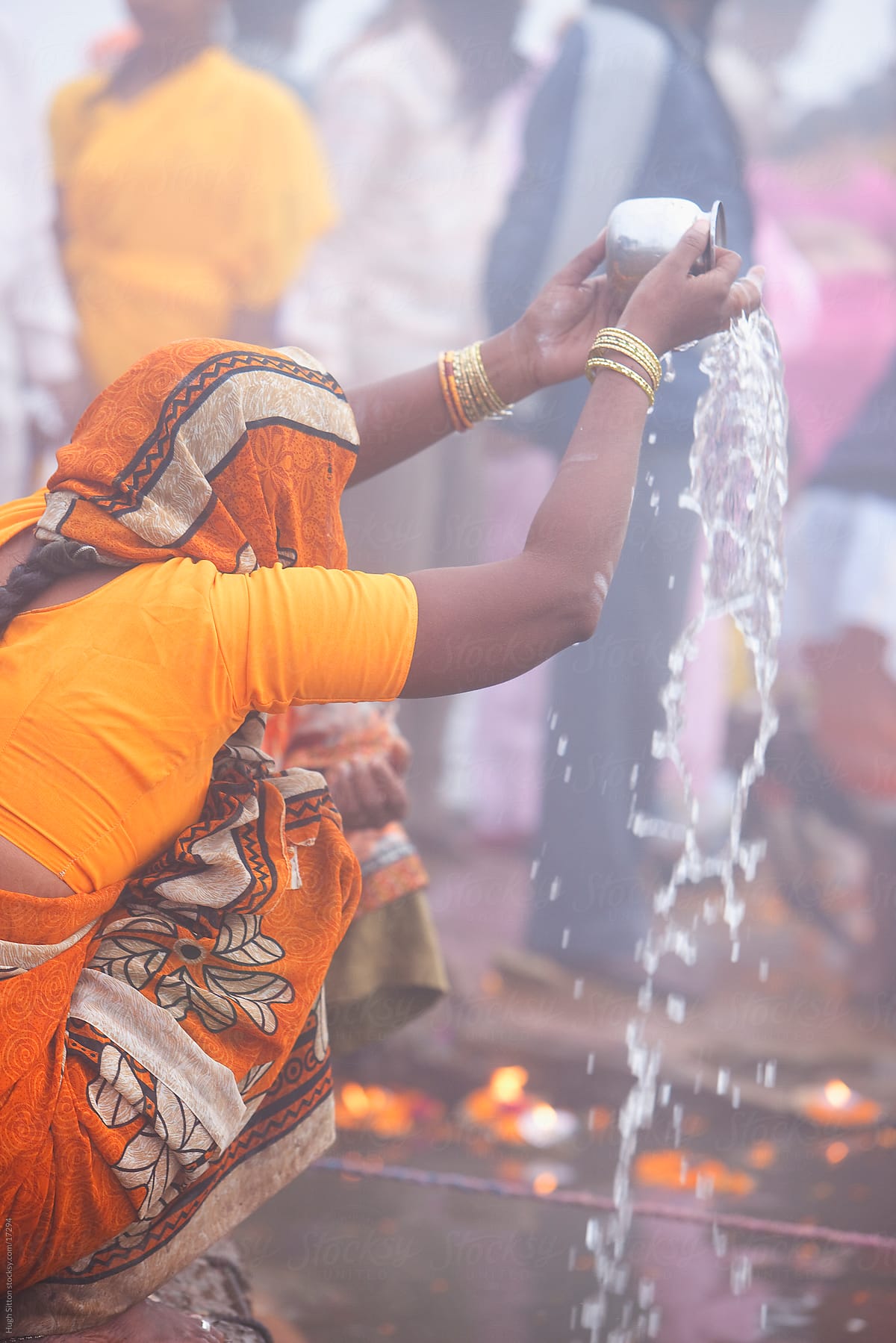 woman in prayer at the River Ganges. Varanasi. India