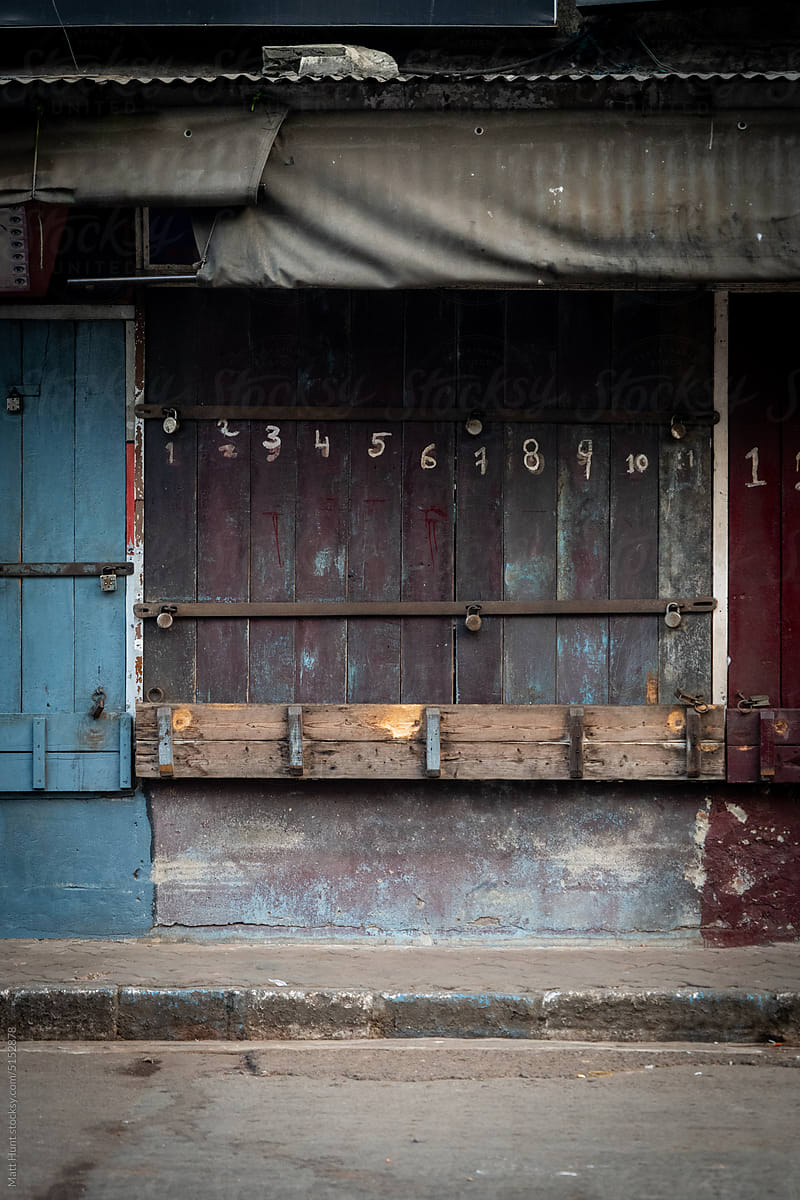 Numbers zero to ten painted on old wooden doors on the street in India