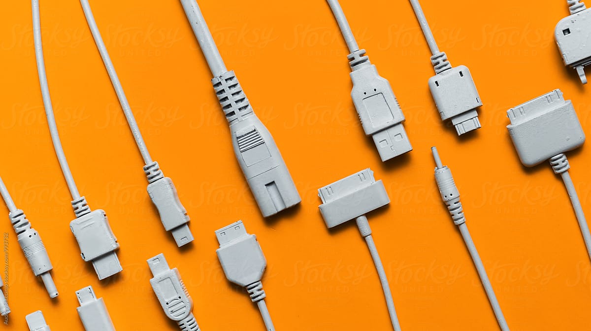 Various cable jacks and plugs on orange background