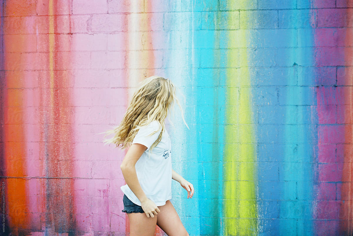 Teenager Girl Against Brightly Colored Walls Wearing Sunglasses On Film By Stocksy Contributor