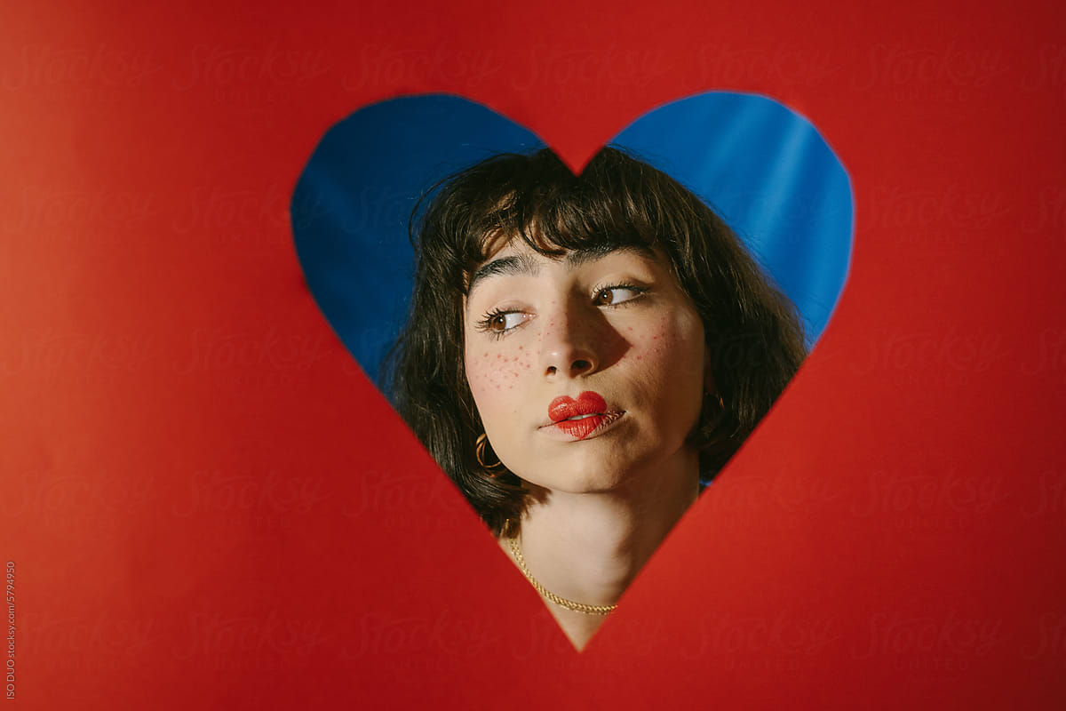 Portrait Of Woman with Heart-Shaped Lips on Blue Background