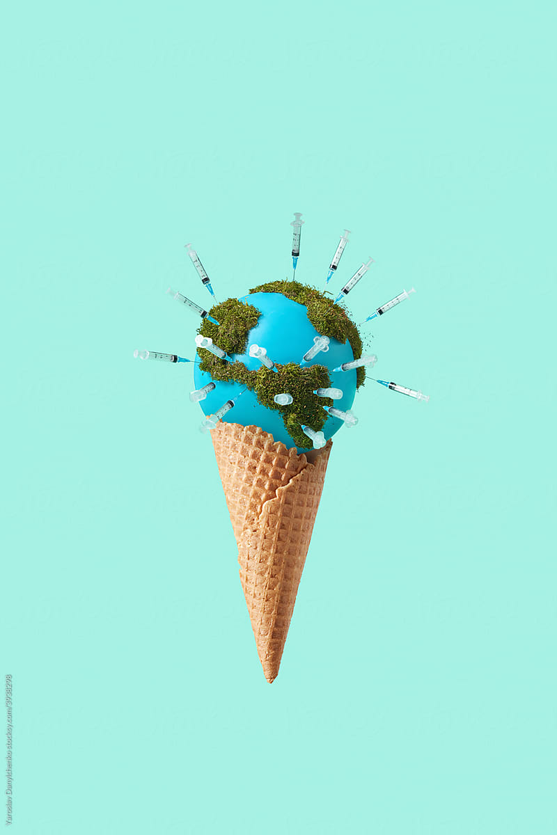 Earth globe with moss and syringes in ice cream cone