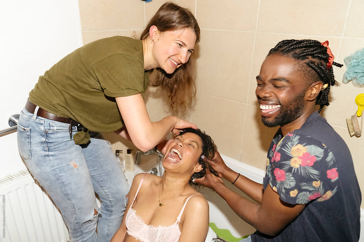 Friends washing Woman\'s Hair