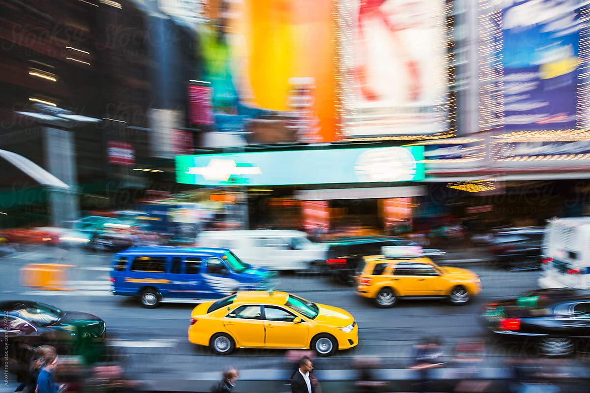 Traffic and people through crowded Times Square in New York City