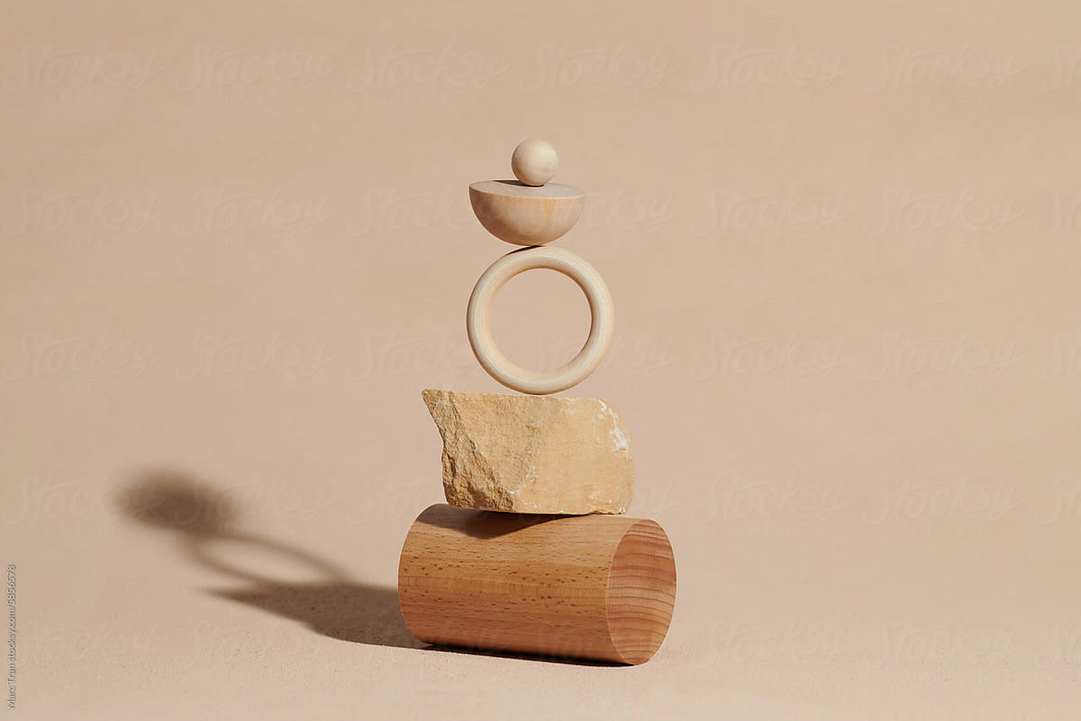 Different wooden geometric shaped objects balancing