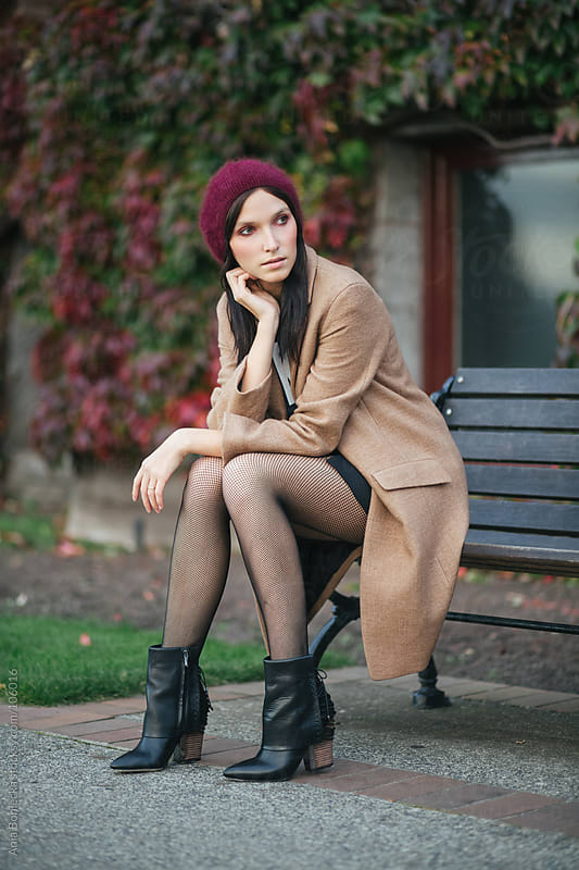 A Beautiful Woman Sitting On A Bench Outside Looking Away Into The Distance By Ania Boniecka 1273