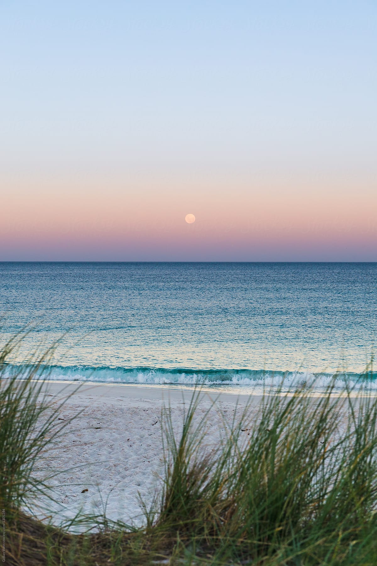 moonrise over the beach and sunset