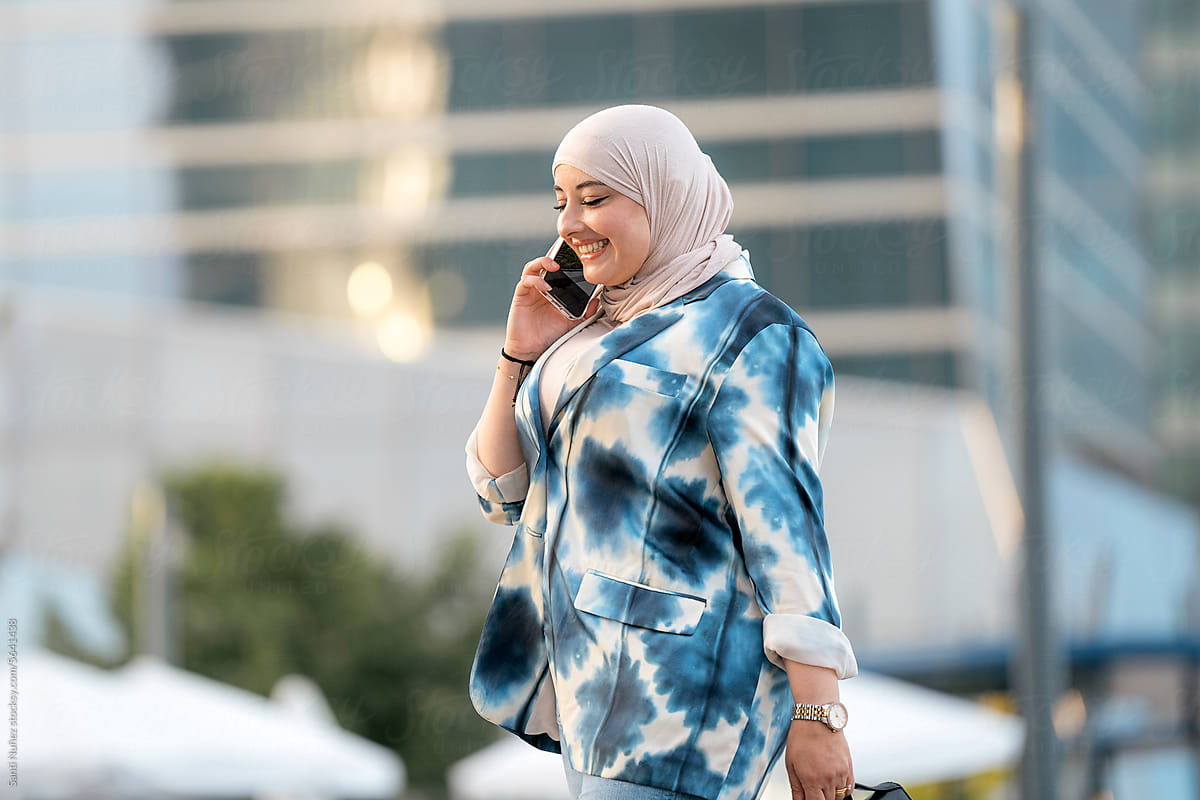 Hijab Businesswoman doing a phone call while Walking