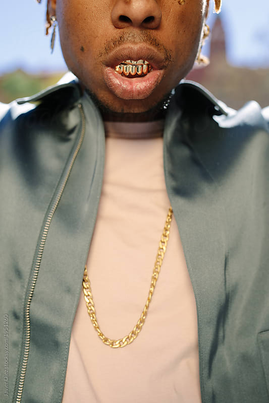 Black boy with gold teeth and cocky attitude