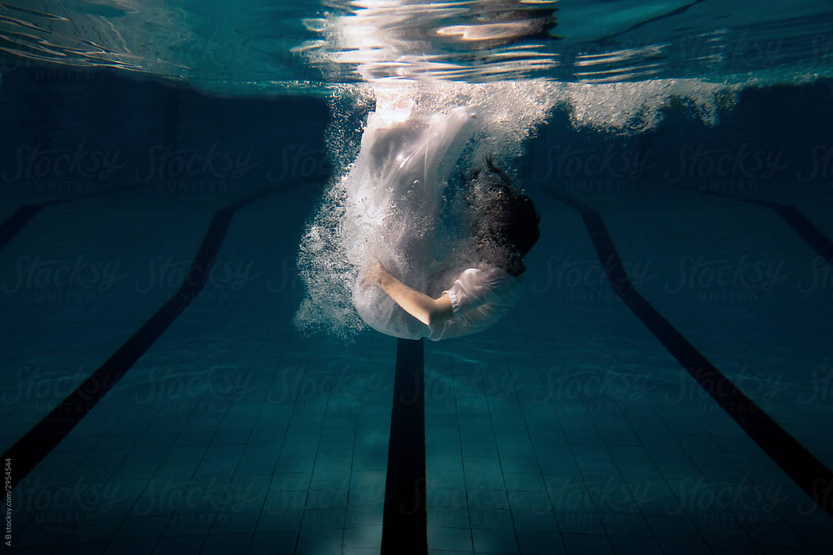 woman falling to water, dive  underwater