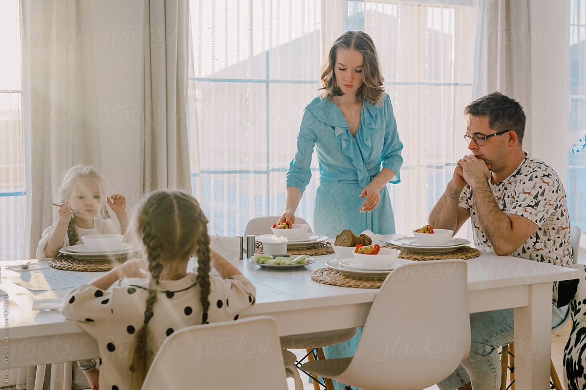 Family preparing to have lunch at home