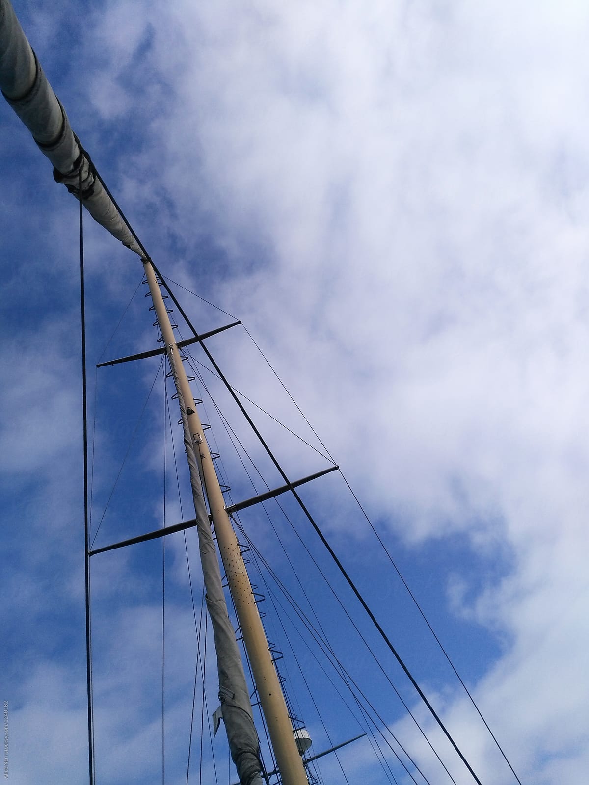 Bottom-up view to mast and cables at the sailing boat