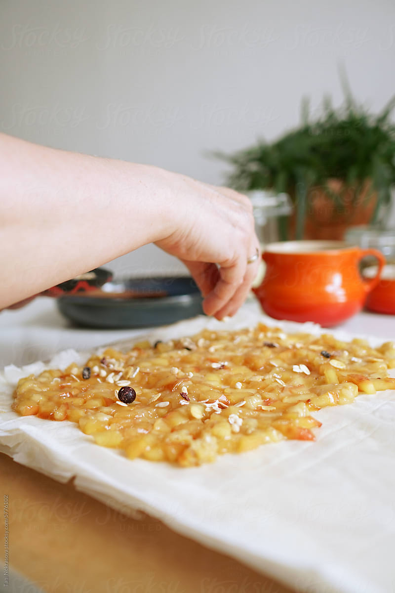 Hand sprinkle the pie with granola and nuts