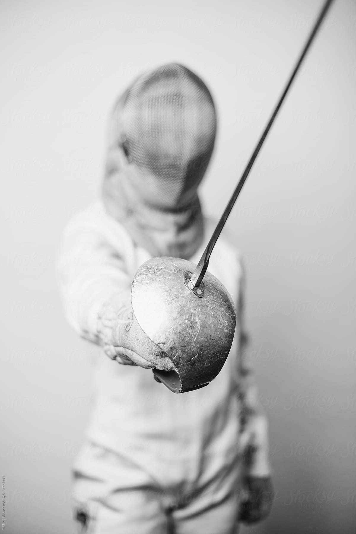 Professional fencing athlete holding sabre
