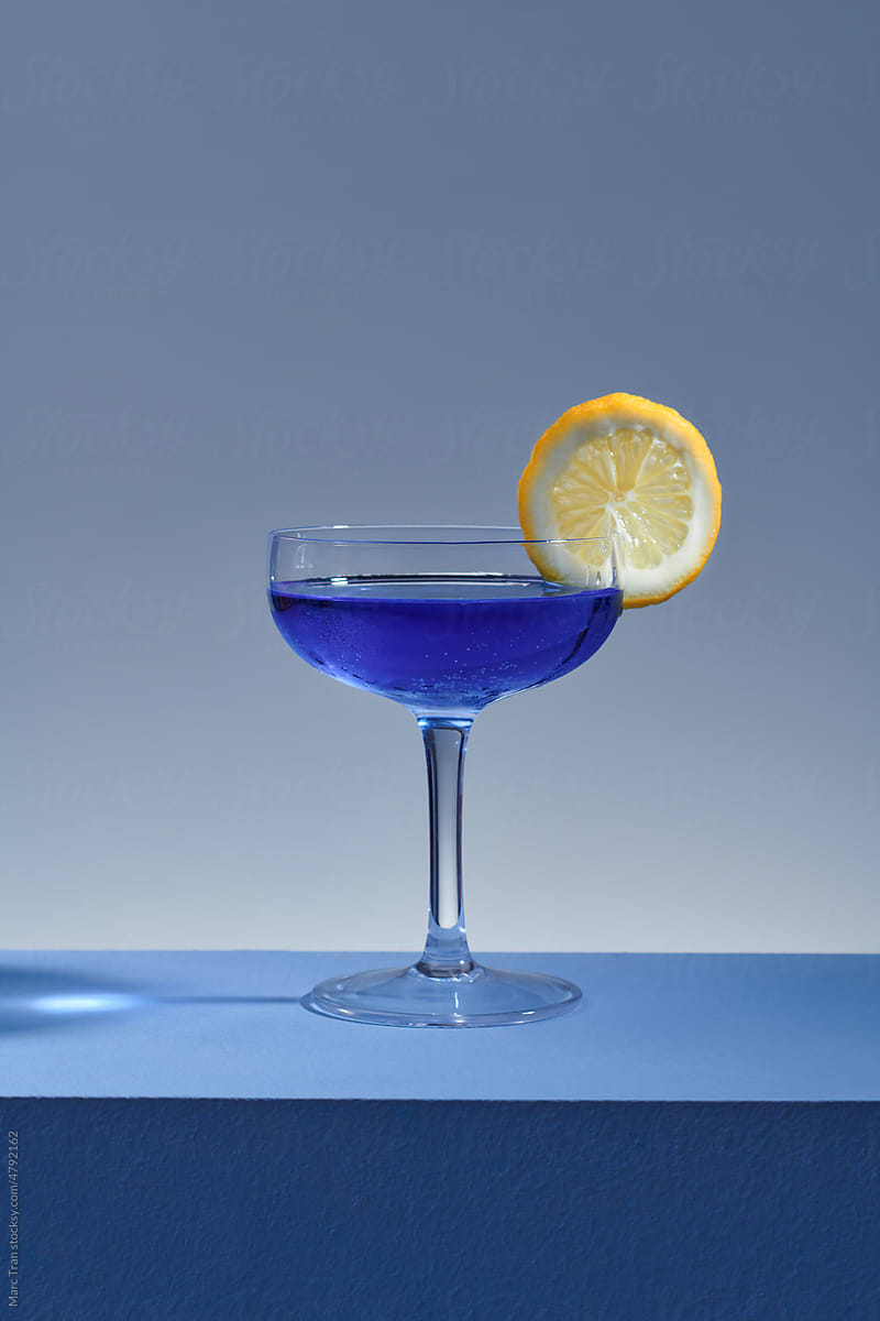 Alcohol drink. Glasses with a blue alcoholic cocktail with ice