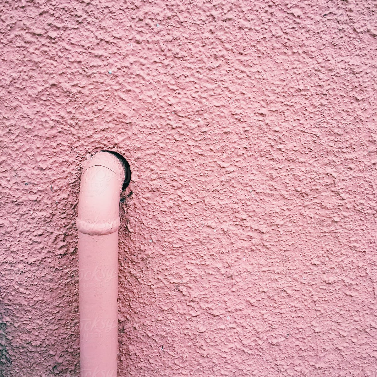 Pink Pipe against Pink Wall