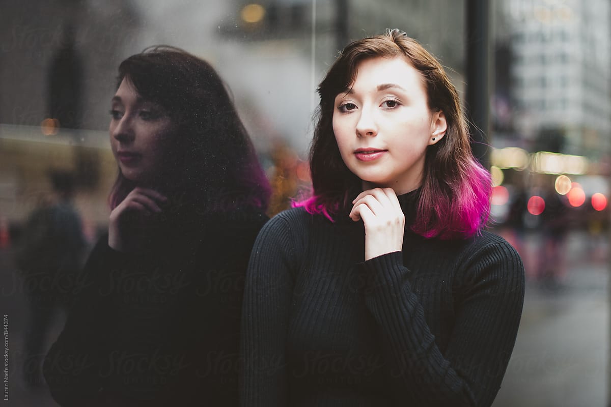 Young woman in the city looking at camera