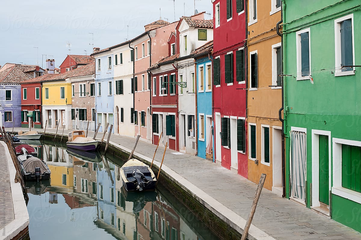 Colorful street with a canal in Burano