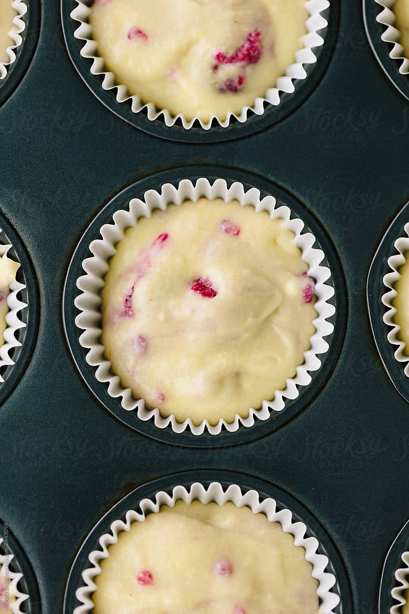 Macro shot of raspberry muffin batter in cake liner