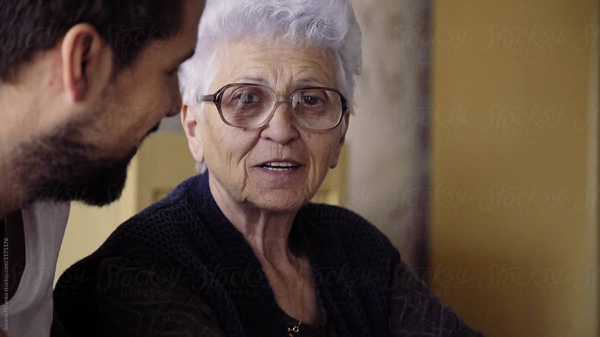 "Grandma And Her Grandson Having A Conversation" by Stocksy Contributor