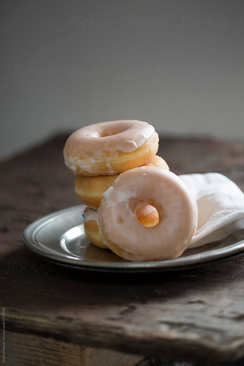 Sugar glazed donuts on vintage plate