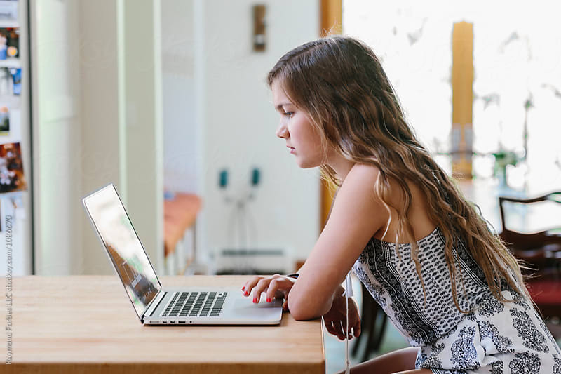 Teen Girl at Home working on Laptop