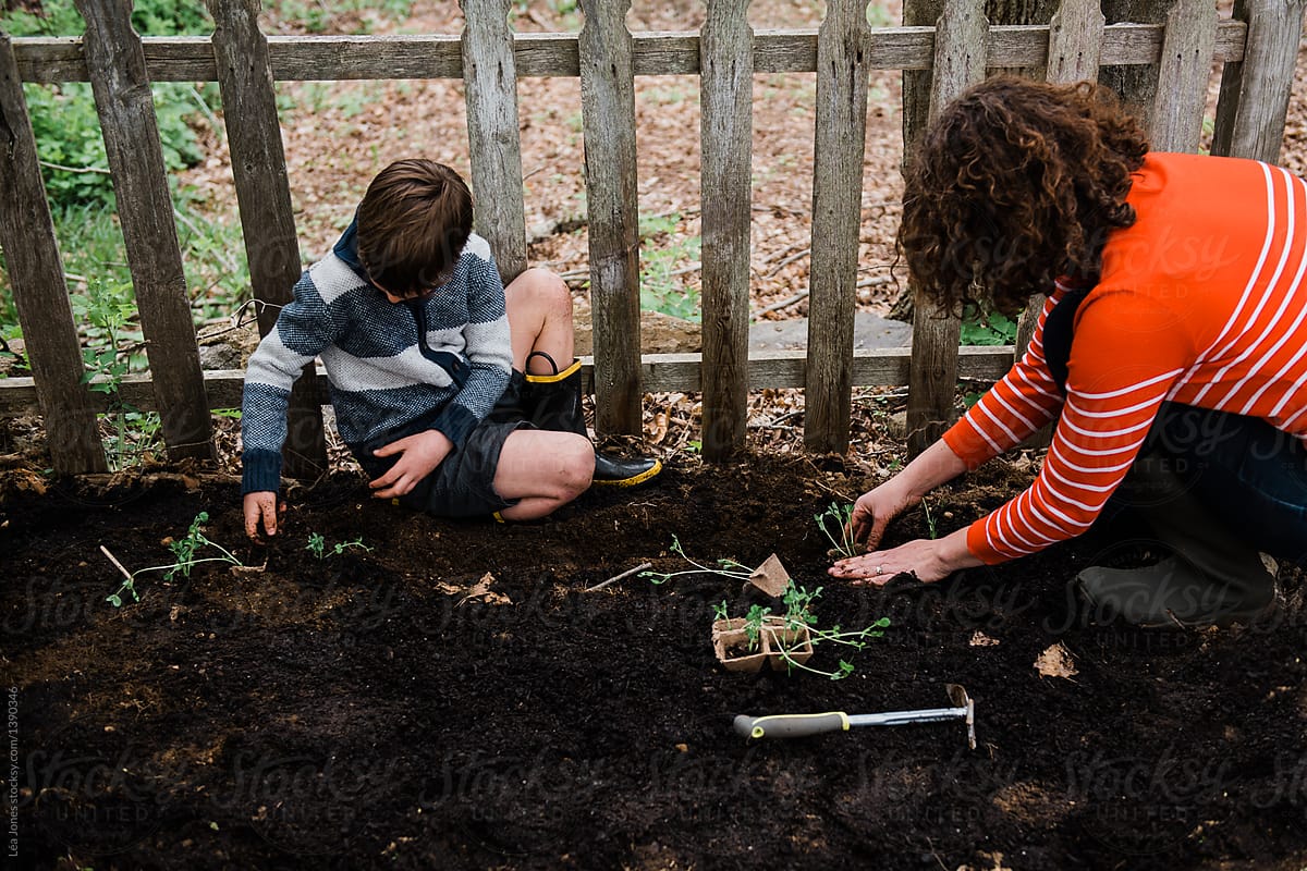 mother and son gardening together