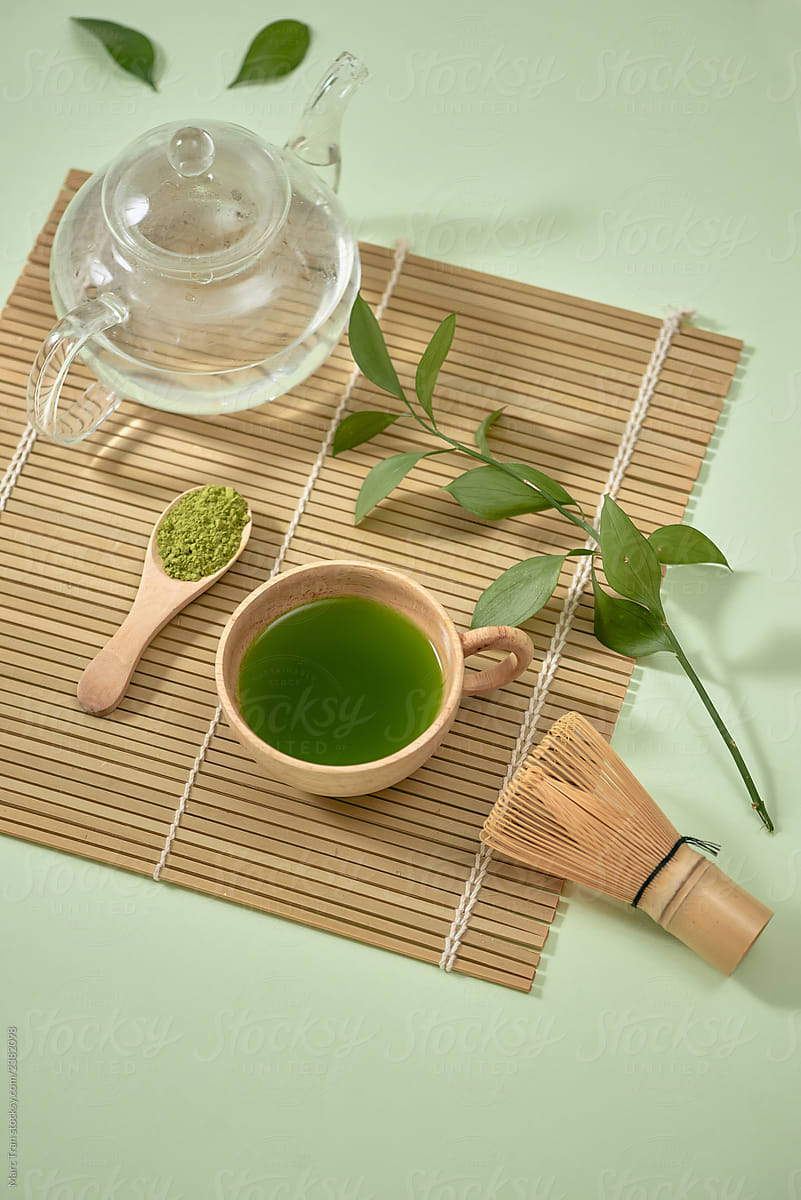 Green matcha tea drink and tea accessories.