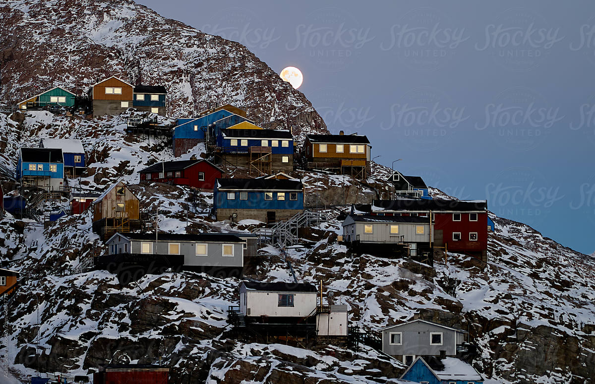 Uummannaq settlement, Greenland - Arctic Circle town, full moon rises
