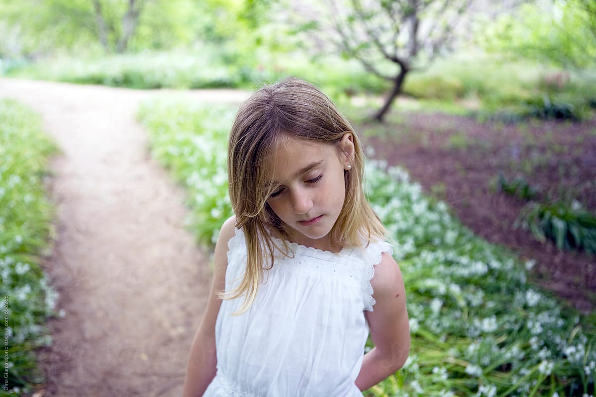Girl With Closed Eyes Standing On A Path By Stocksy Contributor Dina Marie Giangregorio