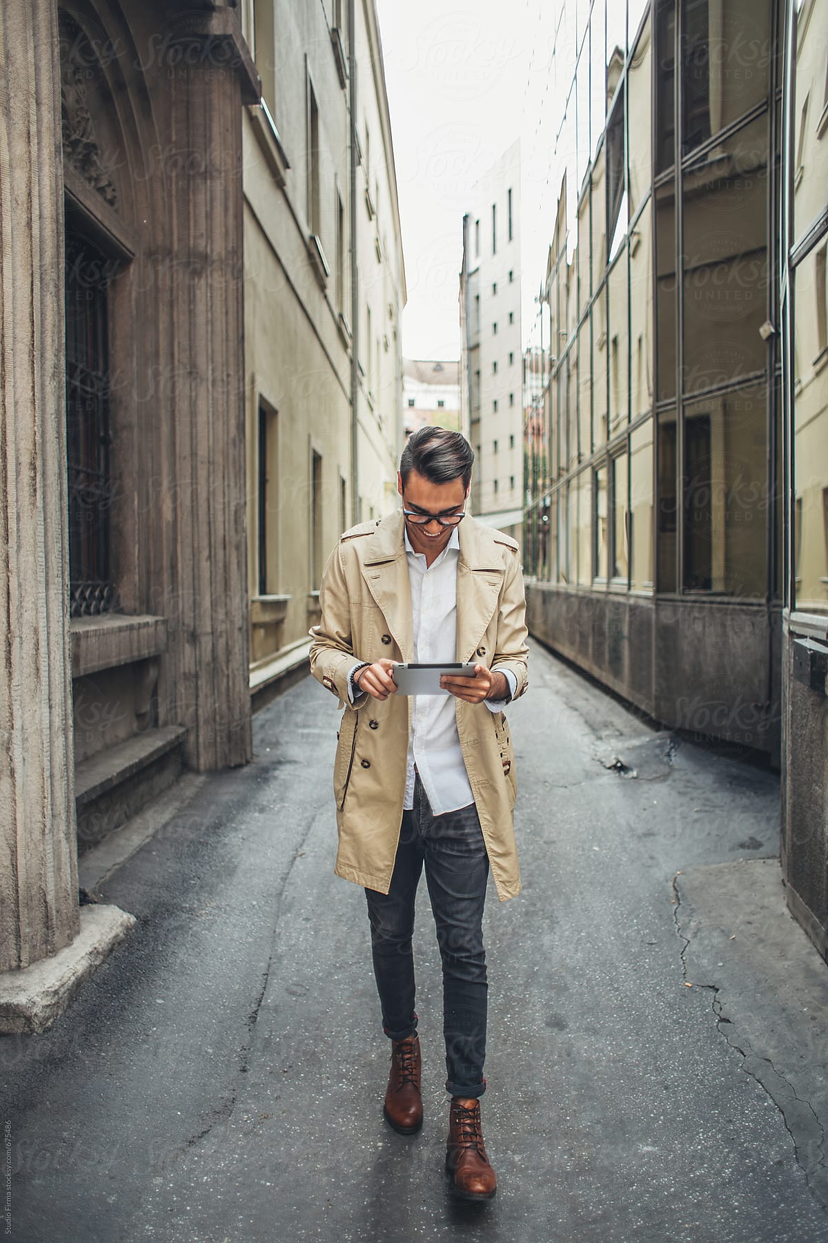 Businessman Using a Tablet on the Street