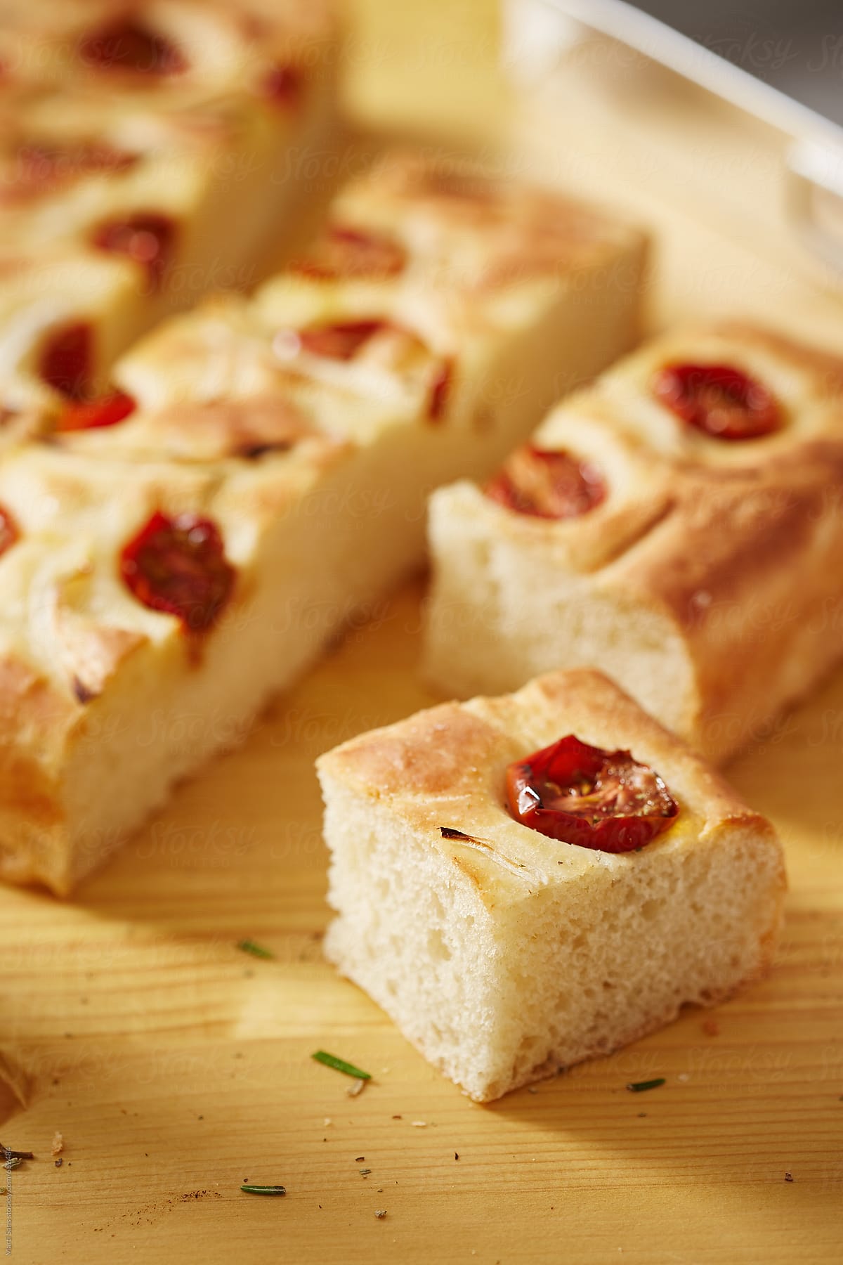 Portions of homemade focaccia with tomatoes