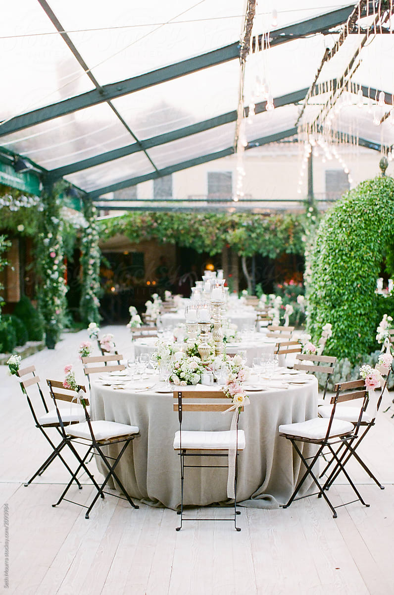 An elegant Italian wedding Reception in a clear marquee