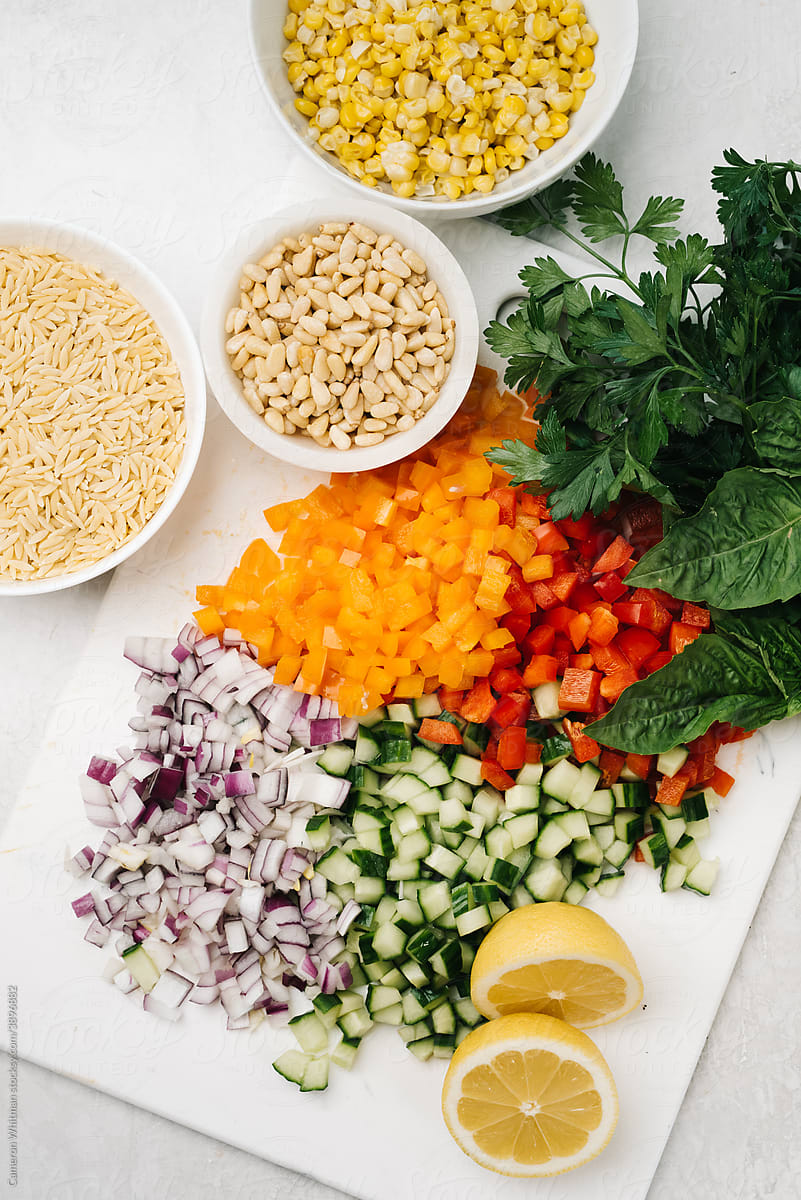 Pasta salad ingredients on a cutting board