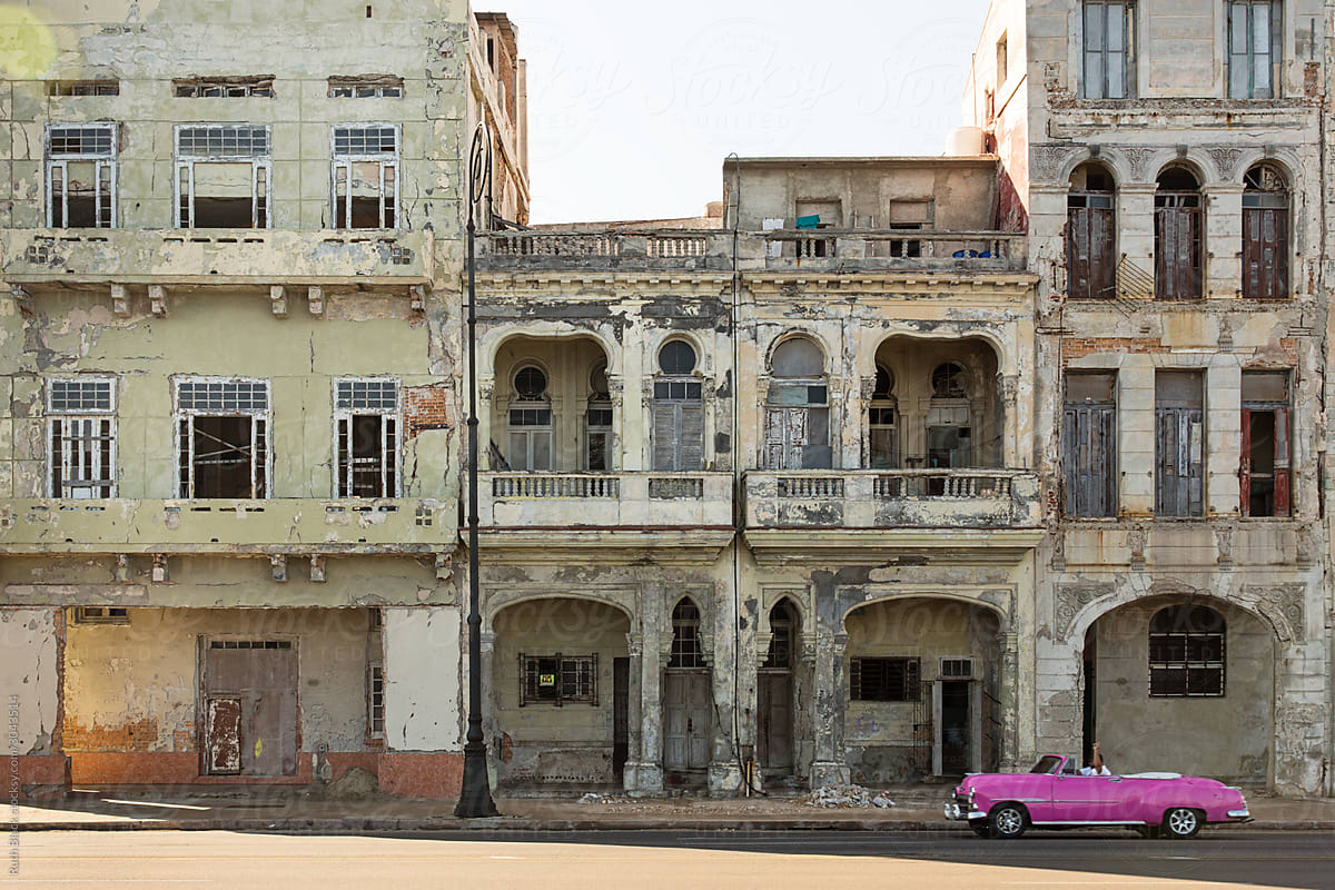 Pink convertible driving along the Malecon, Havana