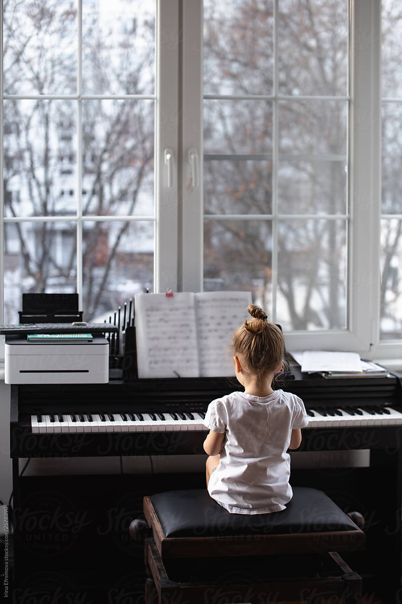 Little girl at a piano