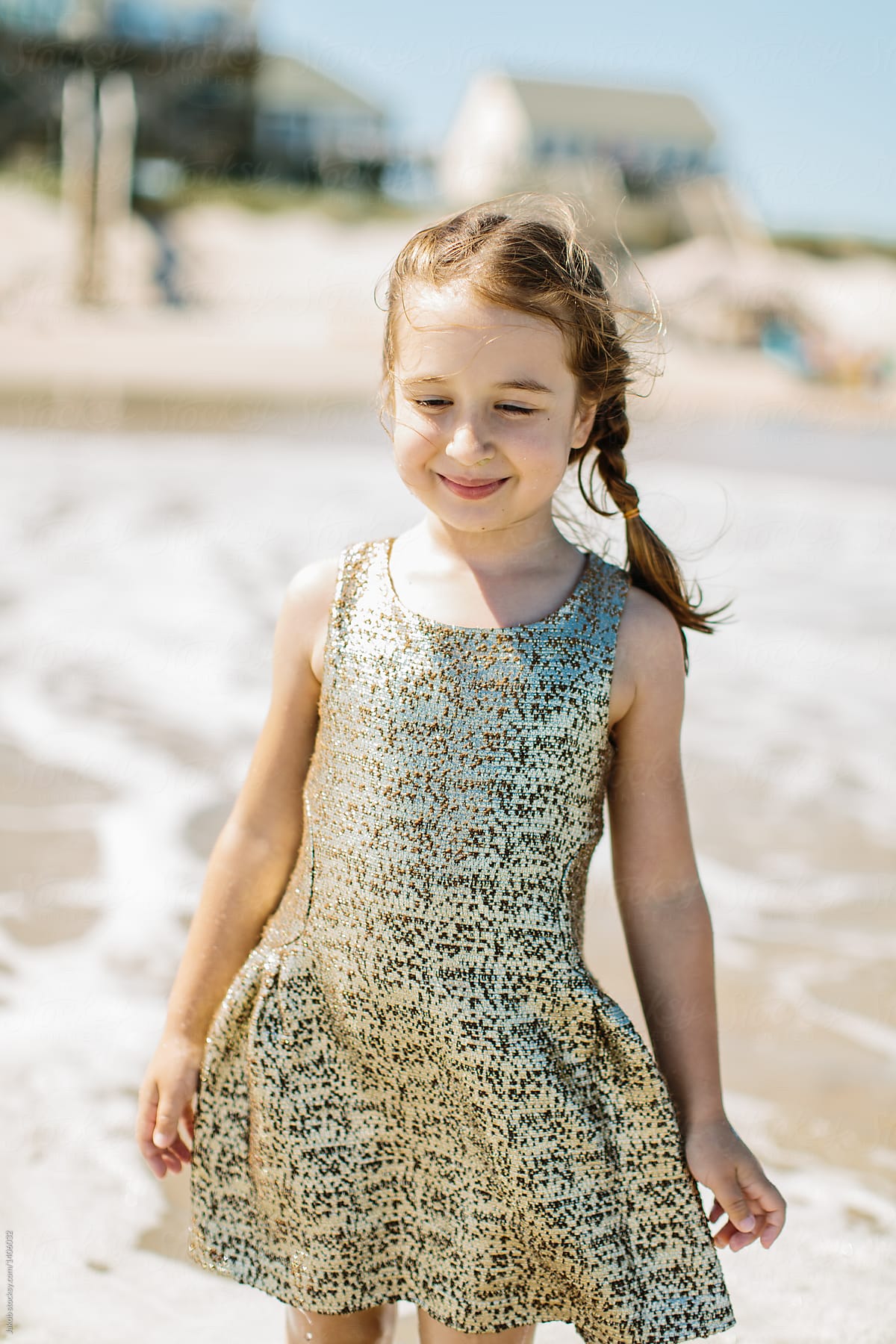 Cute Young Girl Wearing Fancy Gold Dress Playing In The Ocean By 7505