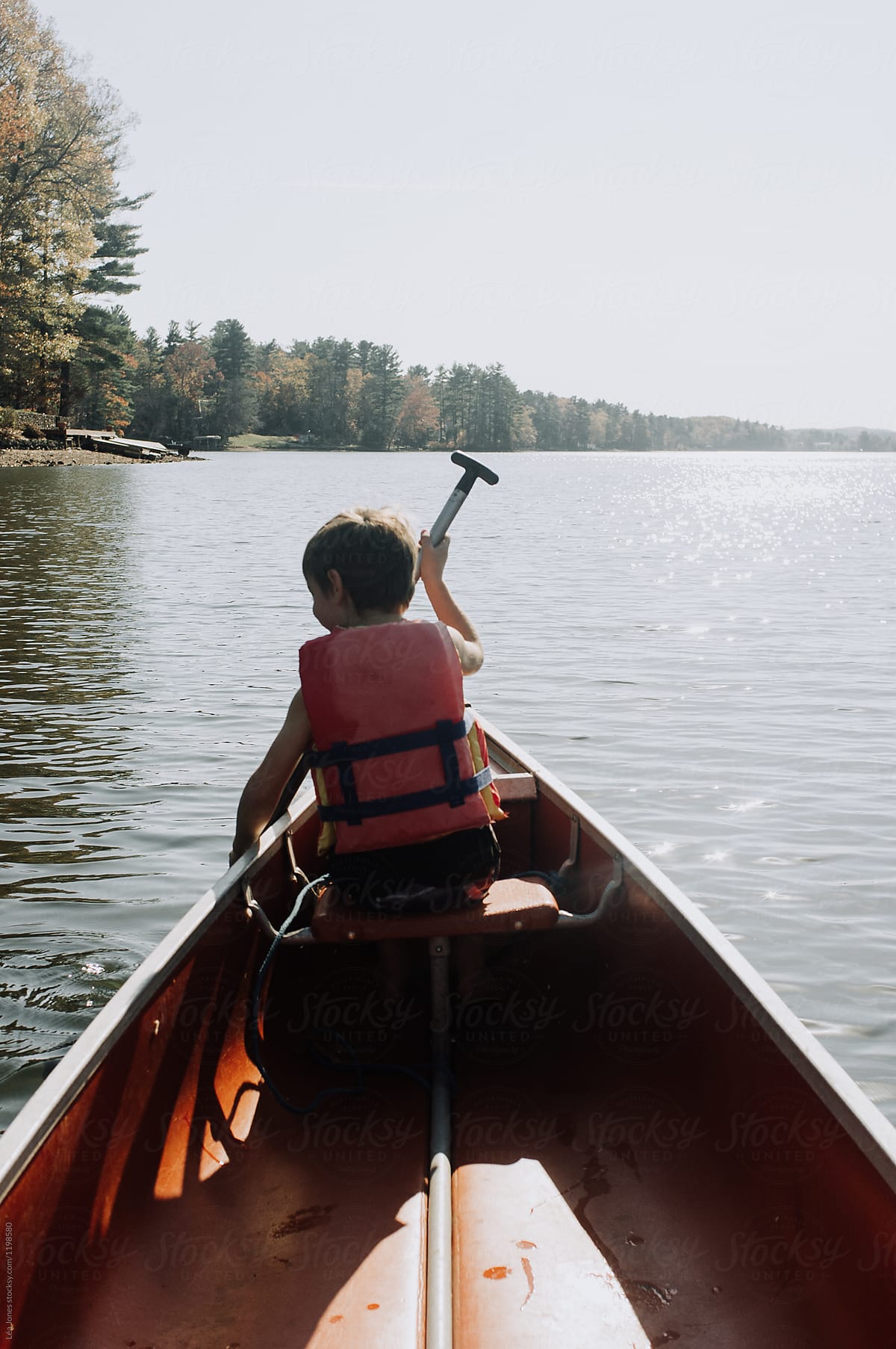 boy rowing in a canoe