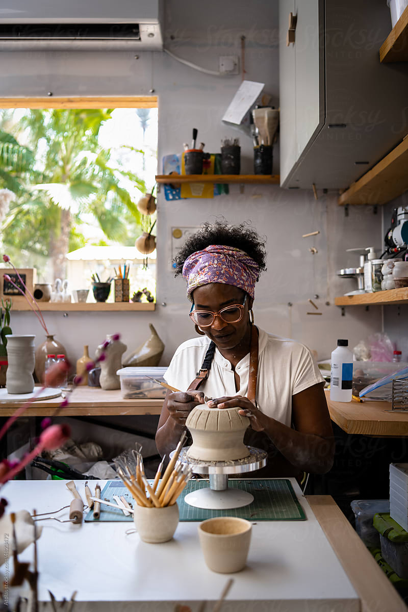 Woman working, creating at her work desk