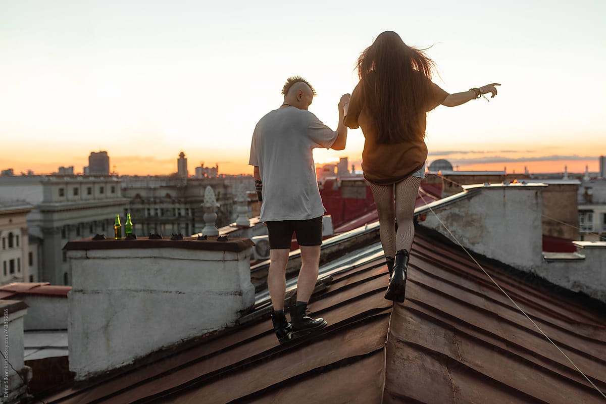 a couple in love walks on the roof
