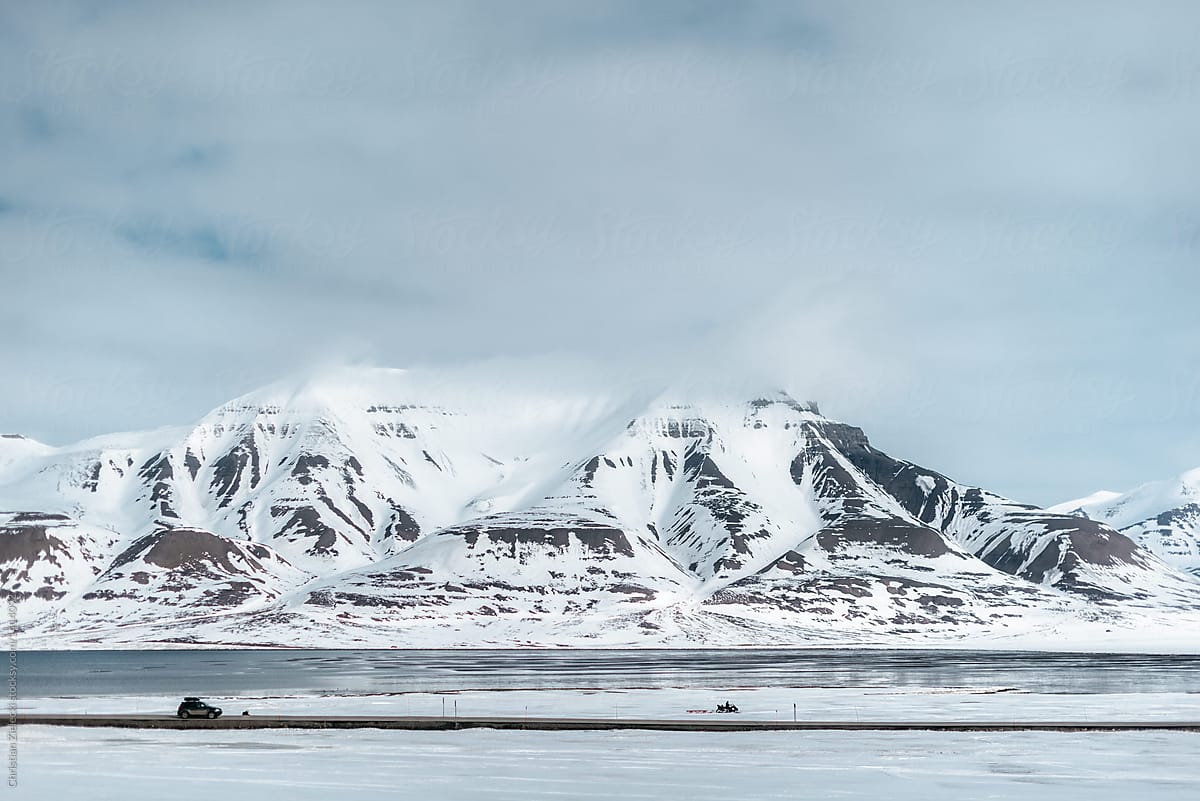 Arctic landscape of snowy island with mountainous coast