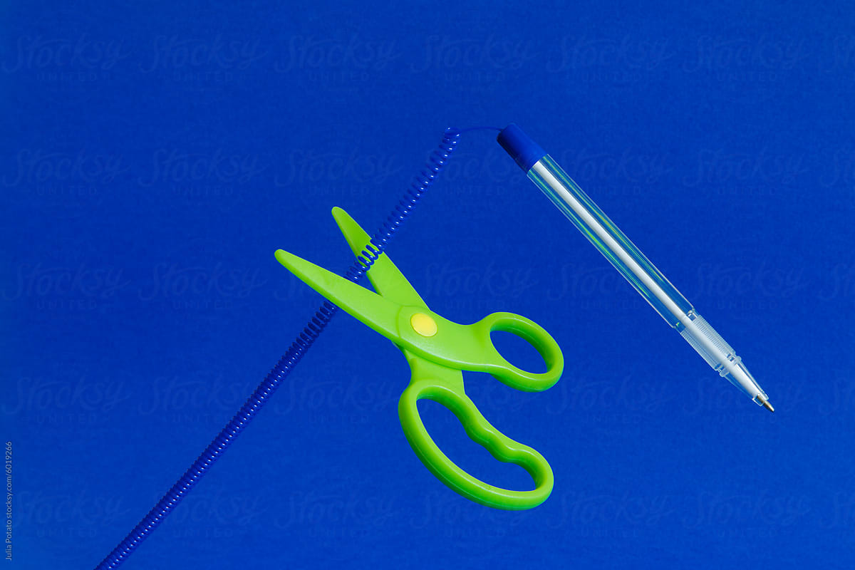 The set with a  hanging pen and scissors cutting a rope