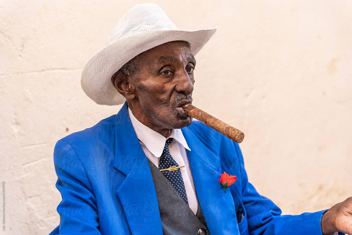 Street Portrait Of Local Man Smoking Cigar In Havana, Cuba