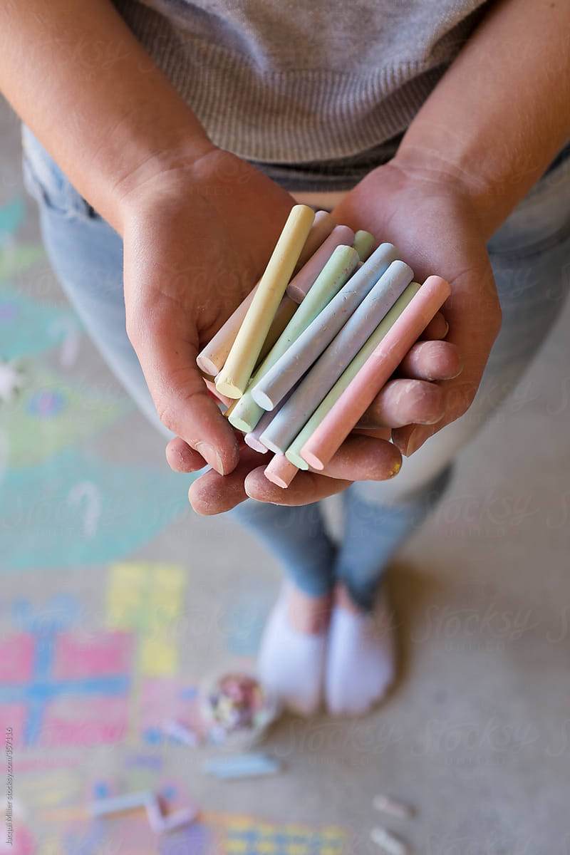 Girl holding a handful of chalk
