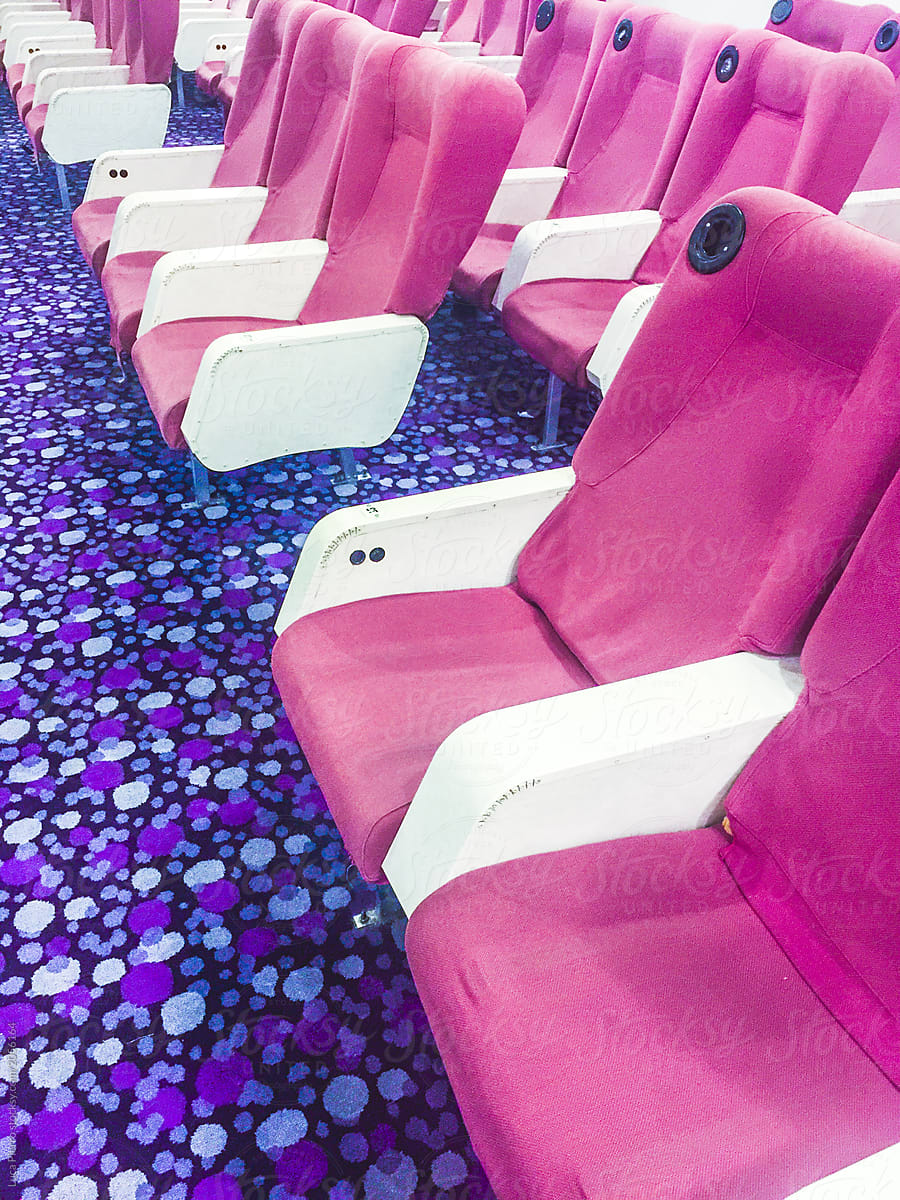 Hall interior with pink seats and violet floor