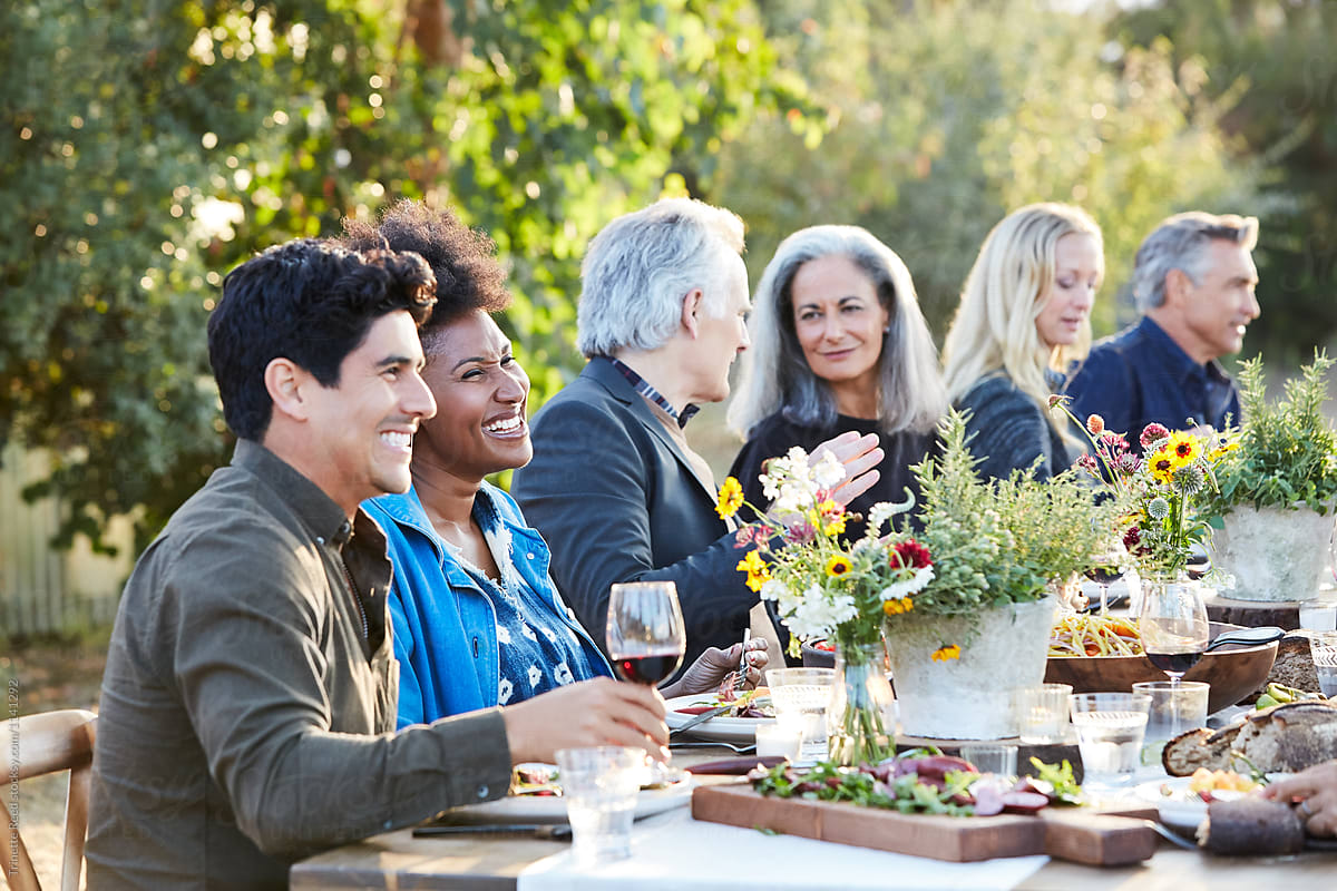 Close-up of friends having an outdoor dinner party