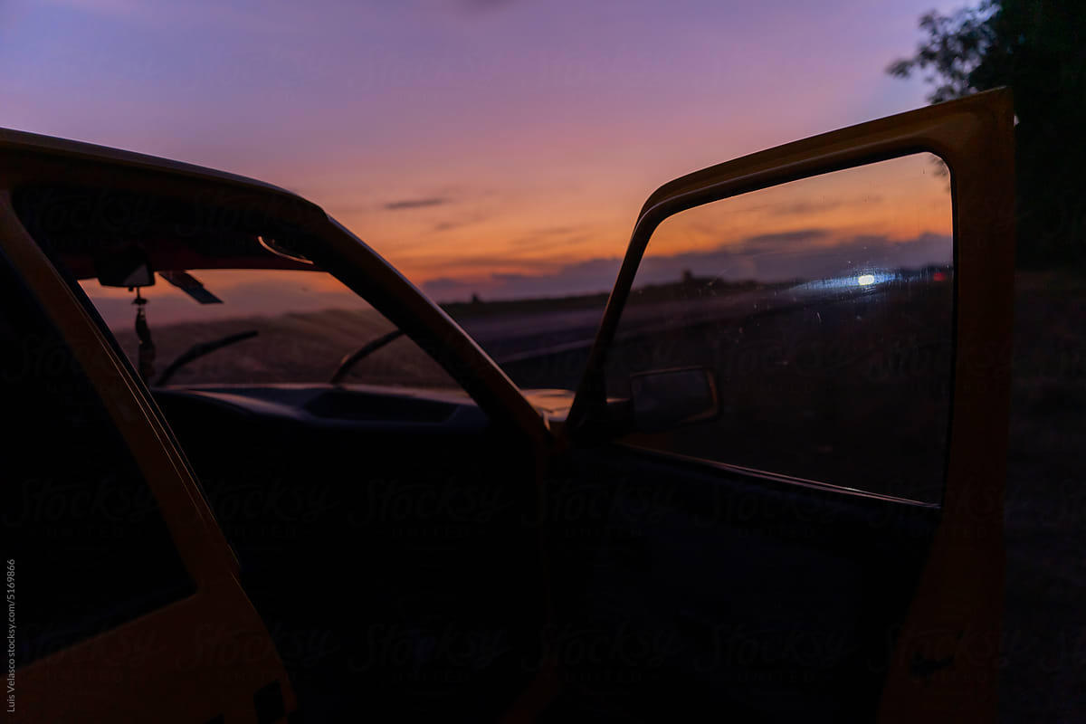 Car At Sunset With Open Doors On A Road Trip