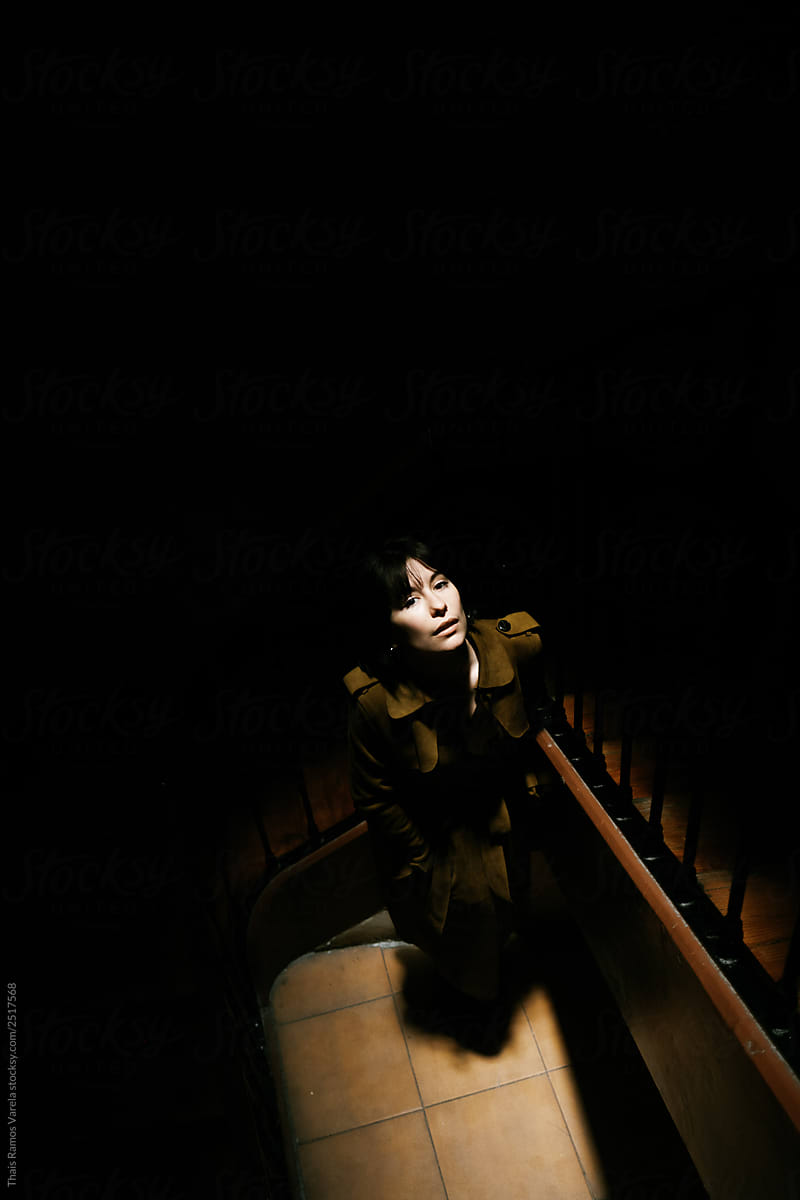 woman in a dark  hall.