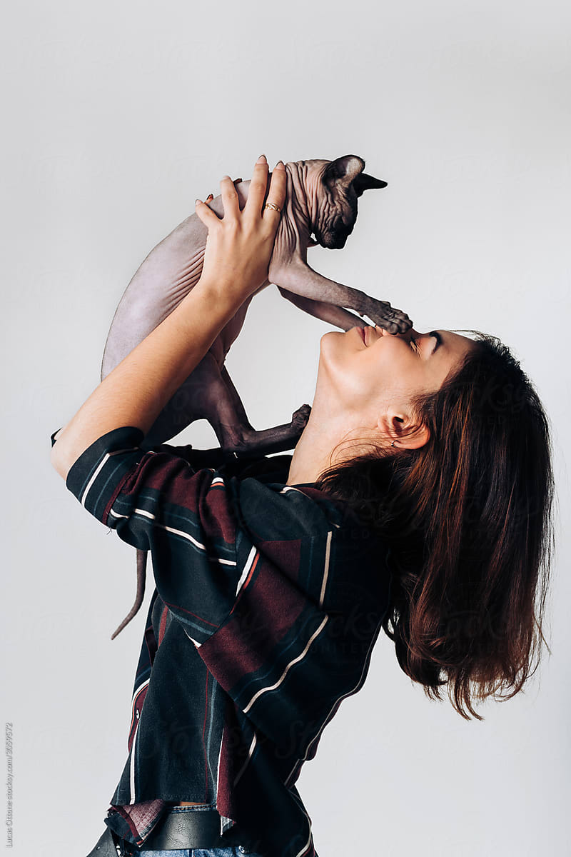 Woman with her Sphynx cat