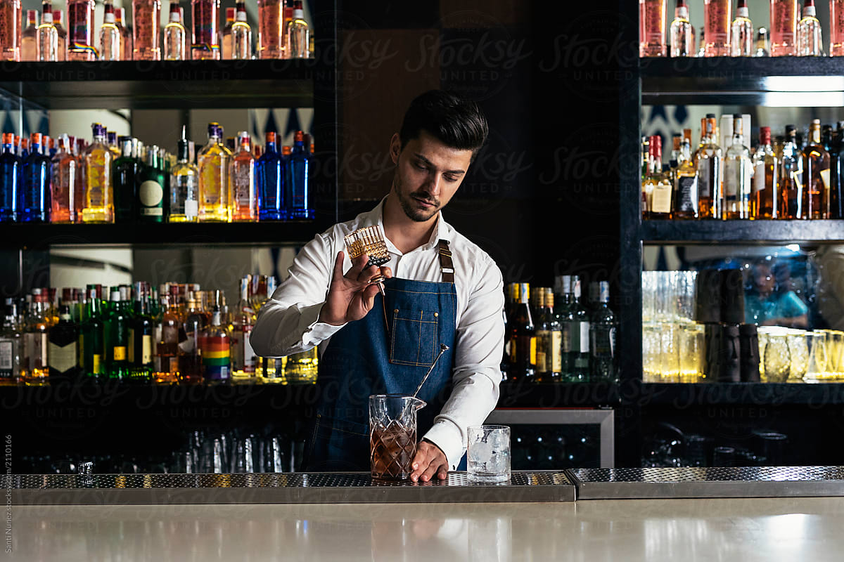 Professional young bartender working